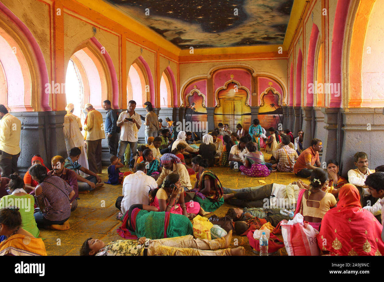 Devotee resting in temple hall, Jejuri, Pune, Maharashtra. Stock Photo