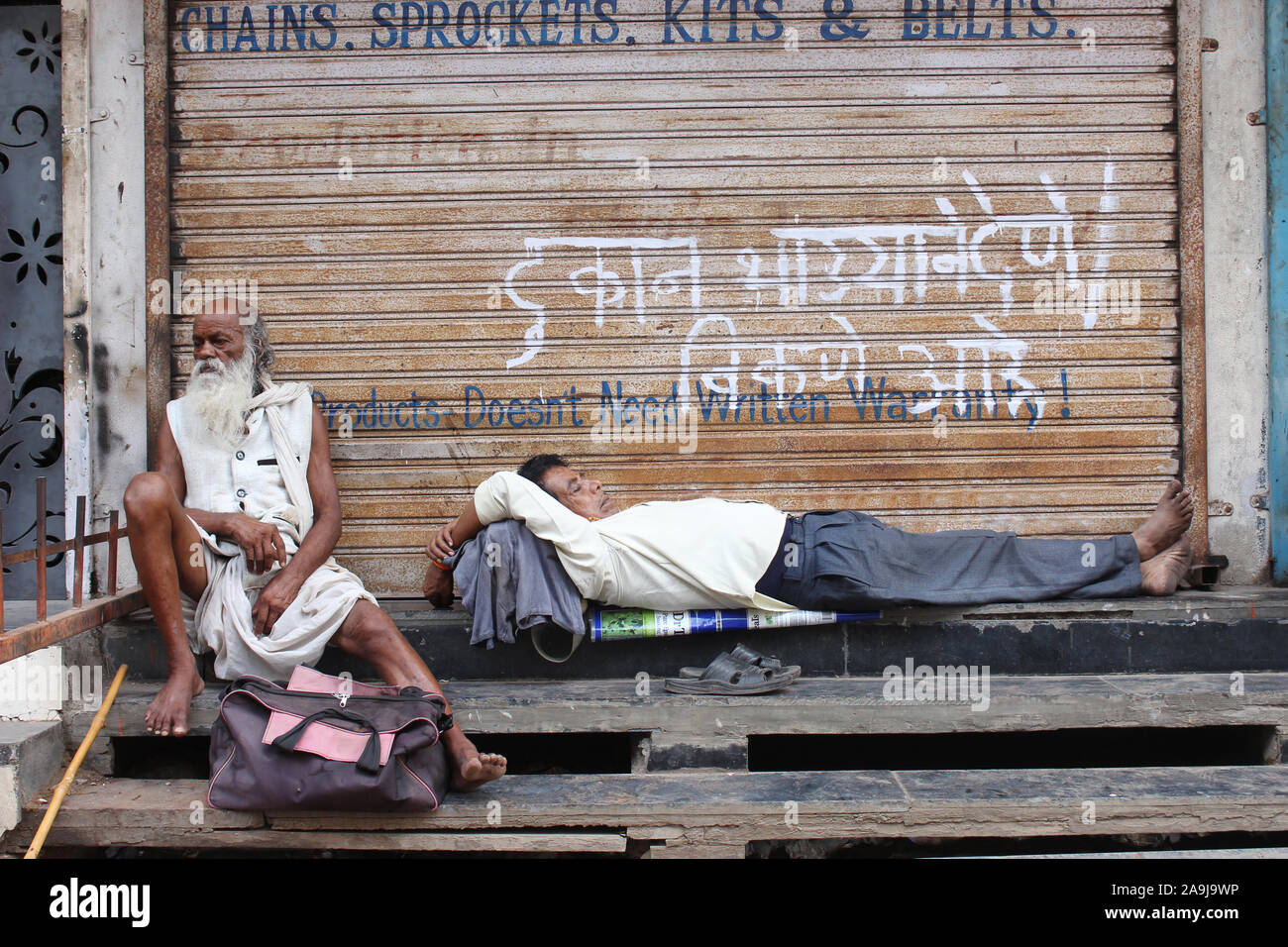 Man resting during Dnyaneshwar Maharaj Palki, Pune, Maharashtra, India Stock Photo