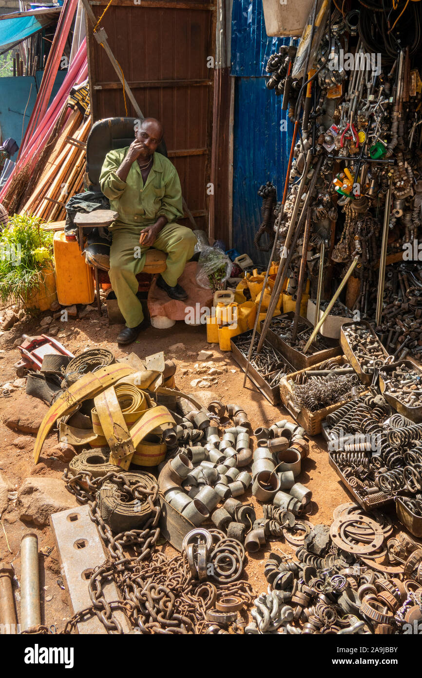 Ethiopia, East Hararghe, Harar, Recycling Market, man selling metal