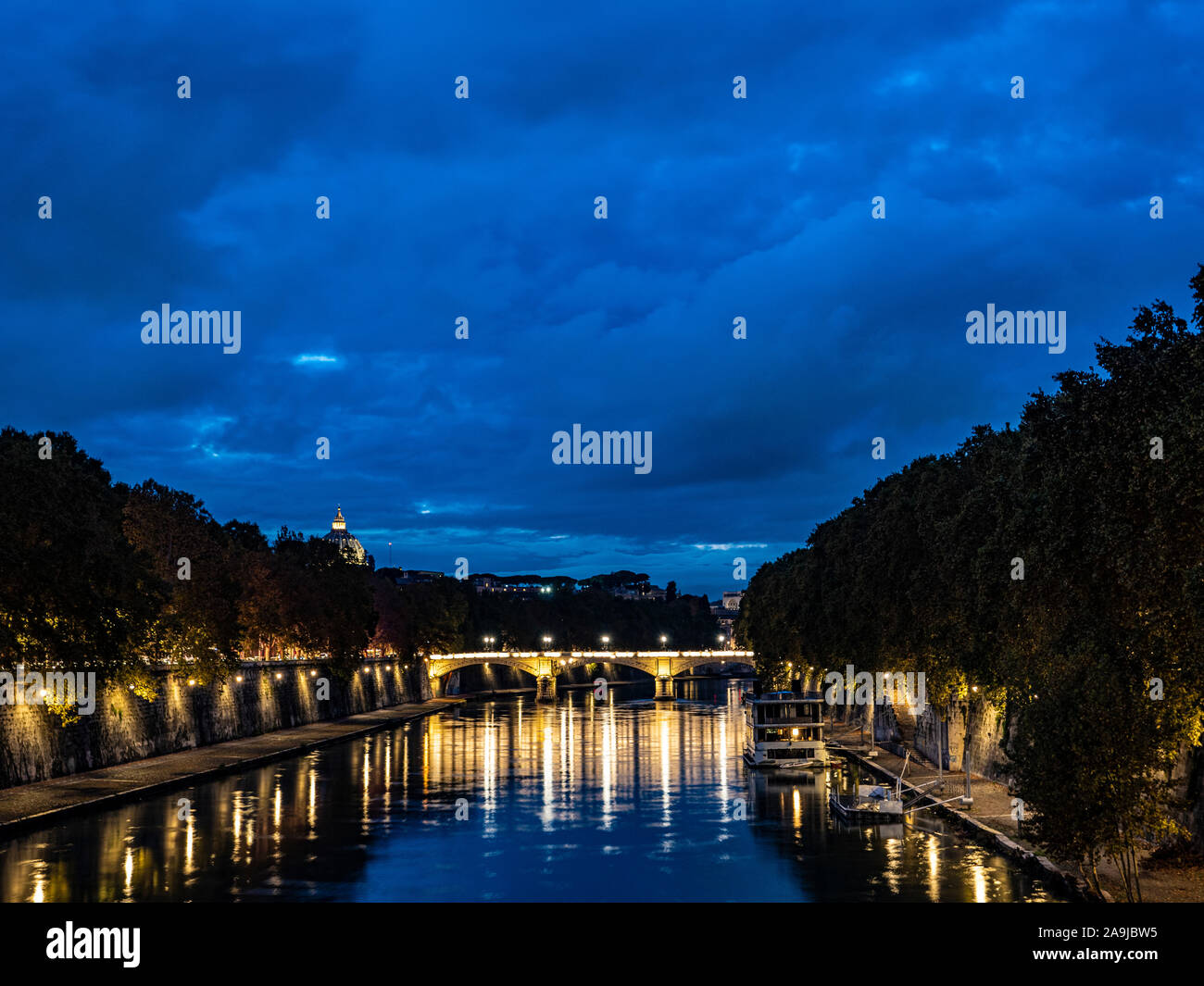 night on bridge Giuseppe Mazzini and the Fiume Tevere river in Rome Italy Stock Photo