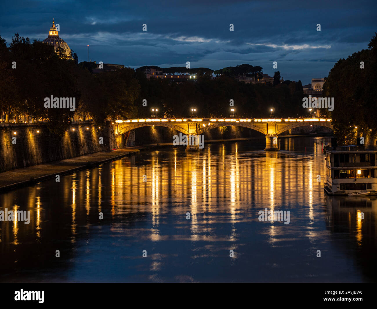 night on bridge Giuseppe Mazzini and the Fiume Tevere river in Rome Italy Stock Photo
