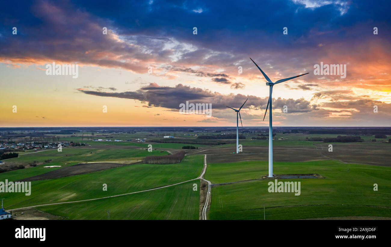 Aerial view of wind turbines and green felds at sunset Stock Photo - Alamy