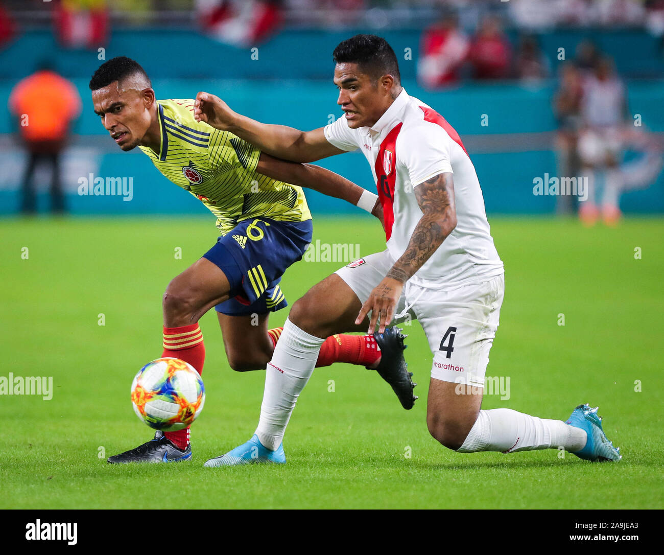 Miami Gardens, Florida, USA. 15th Nov, 2019. Colombia defender William Tesillo (6) tussles for the ball with Peru defender Anderson Santamaria (4) during a friendly soccer match at the Hard Rock Stadium in Miami Gardens, Florida. Credit: Mario Houben/ZUMA Wire/Alamy Live News Stock Photo