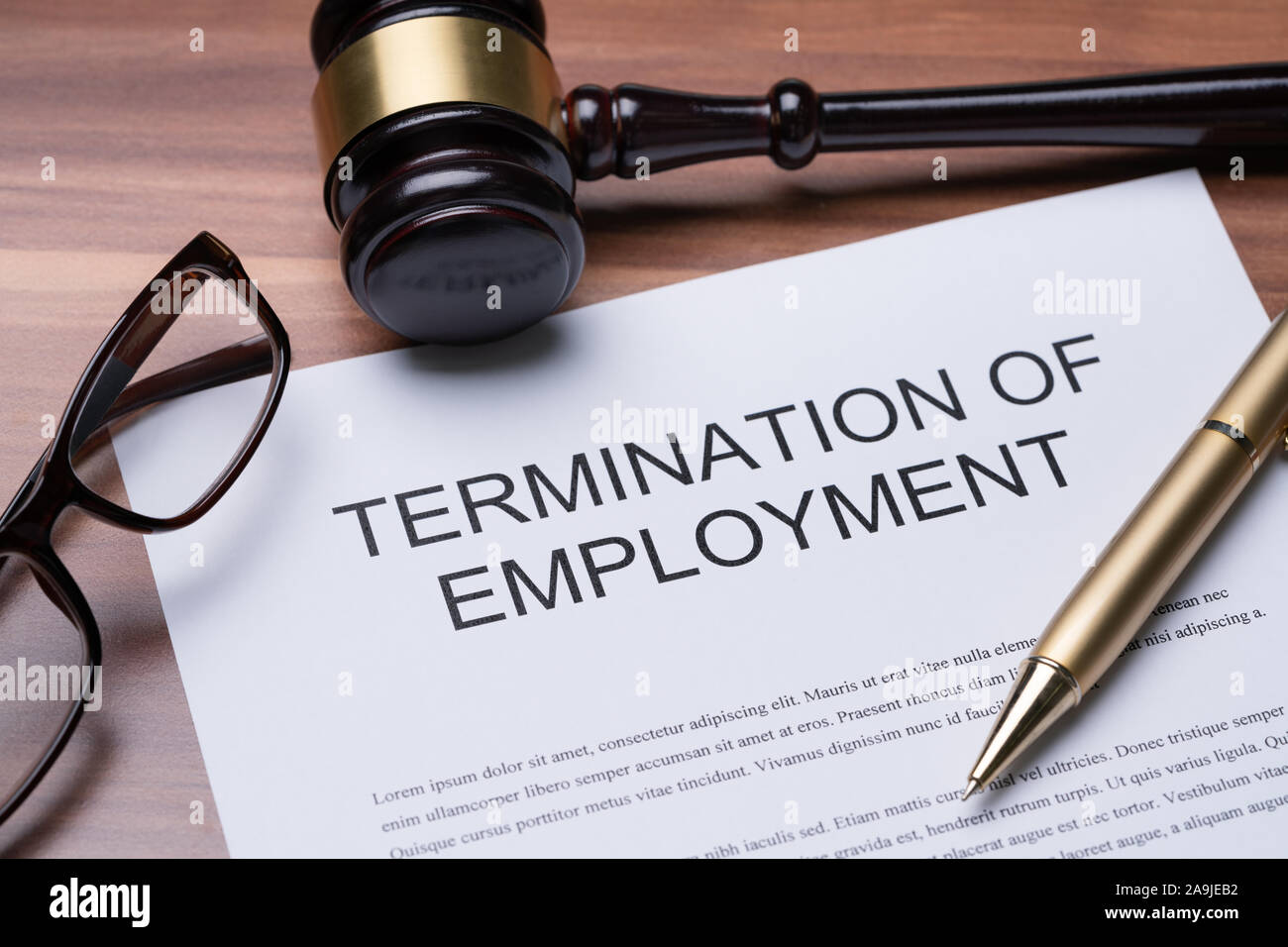Documents About Termination Of Employment With Pen Stock Photo