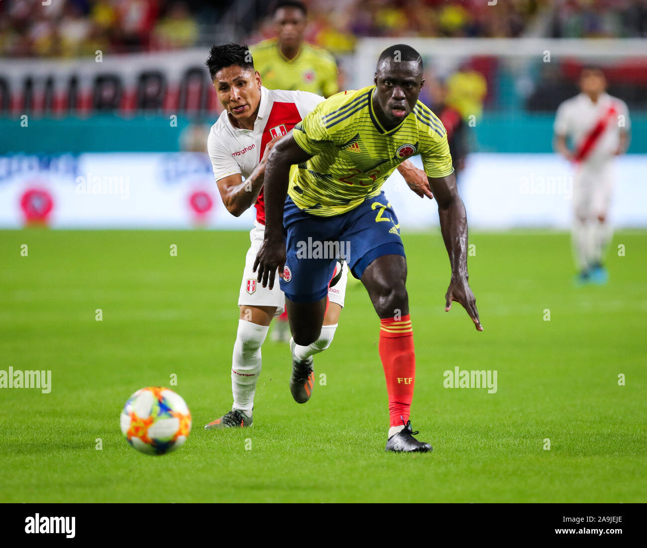 Miami Gardens, Florida, USA. 15th Nov, 2019. Colombia defender Davinson Sanchez (23) wins control of the ball over Peru forward Raul Ruidiaz (11) during a friendly soccer match at the Hard Rock Stadium in Miami Gardens, Florida. Credit: Mario Houben/ZUMA Wire/Alamy Live News Stock Photo