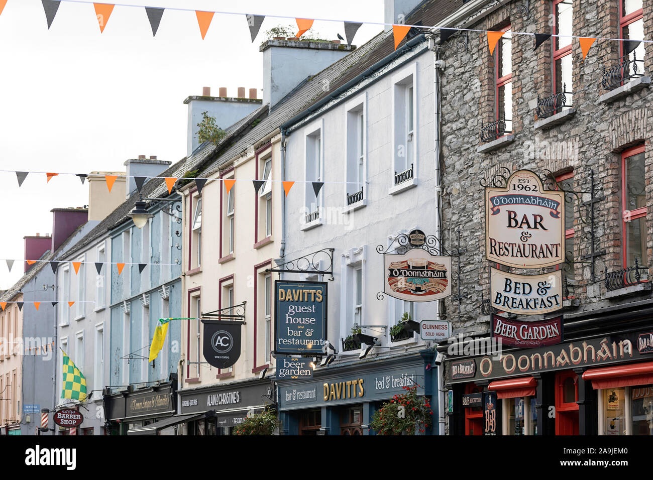 Pubs, shop, hotels and restaurants on a halloween decorated street in