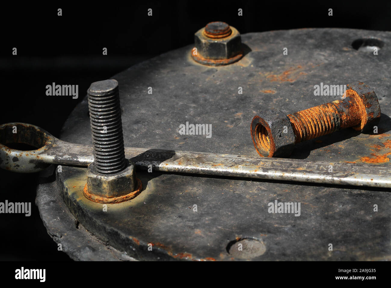 Rusting nuts and bolts with stainless steel spanner Stock Photo Alamy