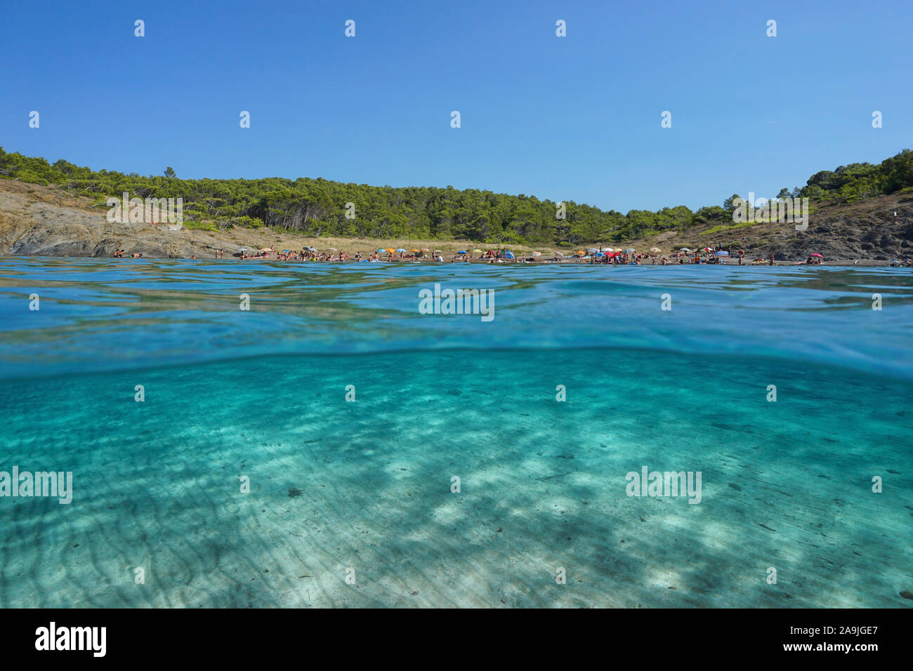 Spain summer vacation, beach coastline with sand underwater, split view over under water surface, Mediterranean sea,  Costa Brava, Catalonia, Llanca Stock Photo