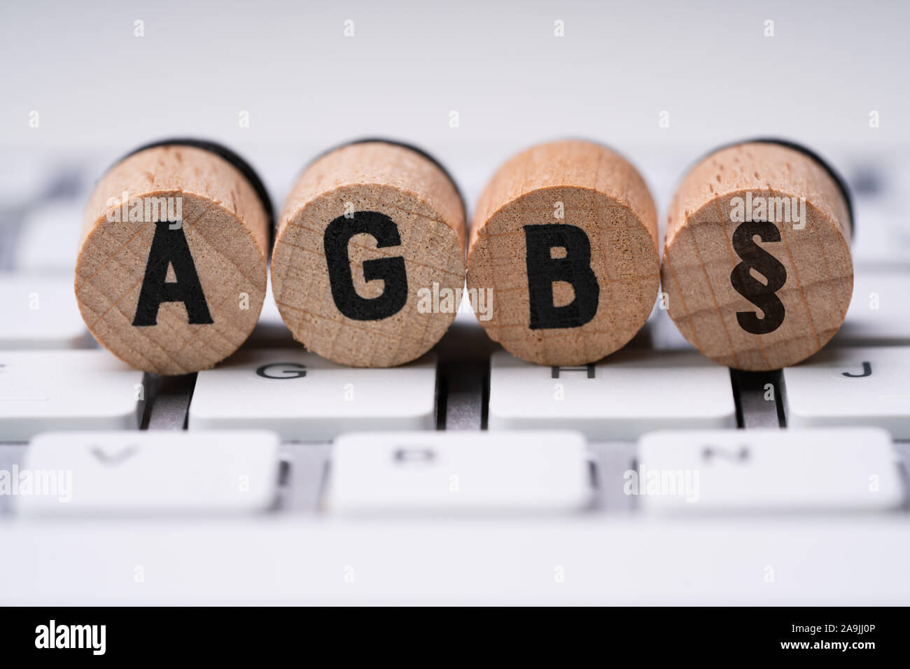 Closeup Of AGB Letters On Computer Keyboard. Standard Form Contract In Germany Stock Photo