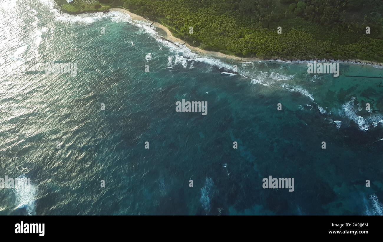 Blue Caribbean sea shore side aerial drone view Stock Photo
