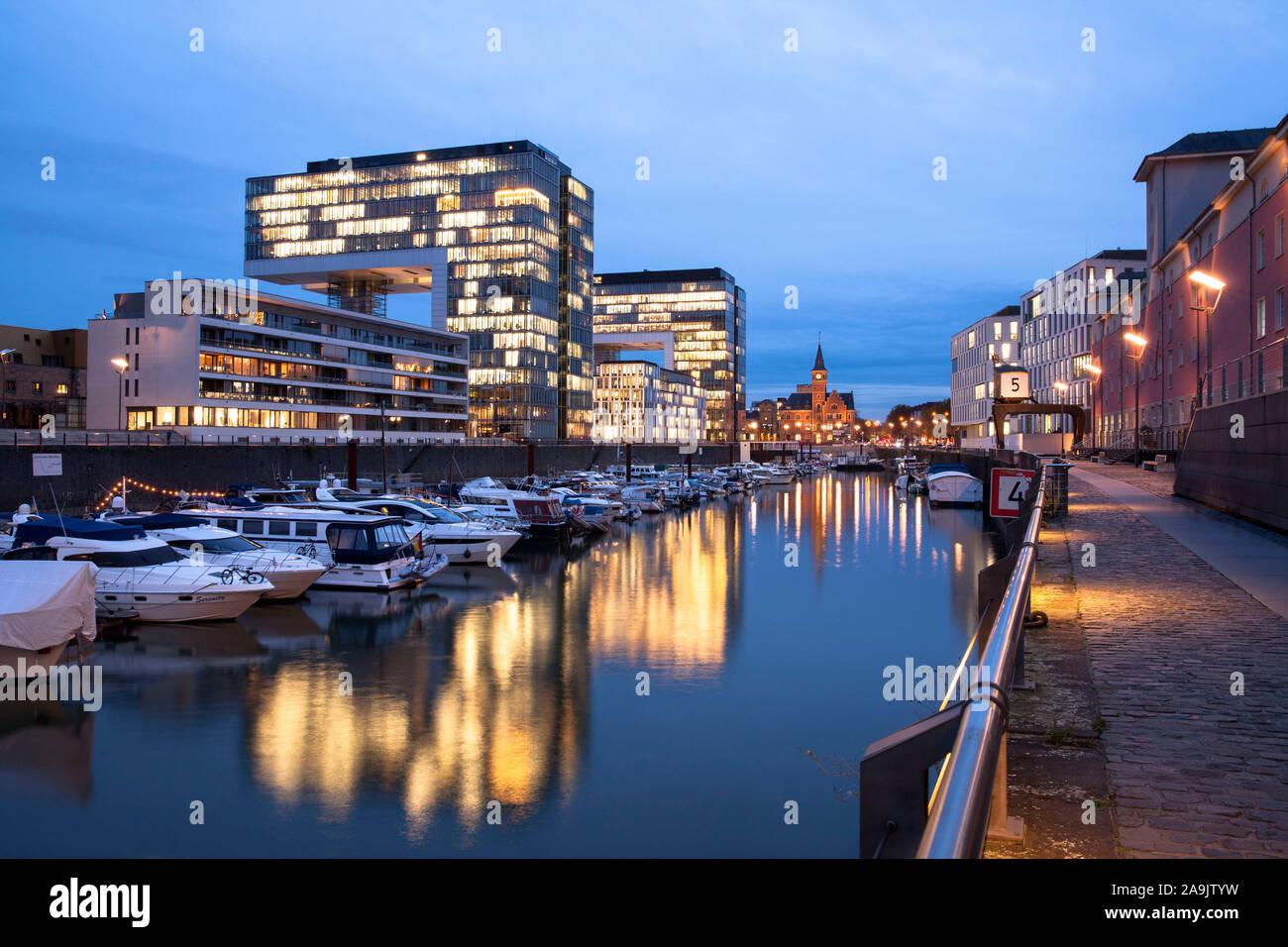 the Crane Houses in the Rheinau harbour, in the background the old