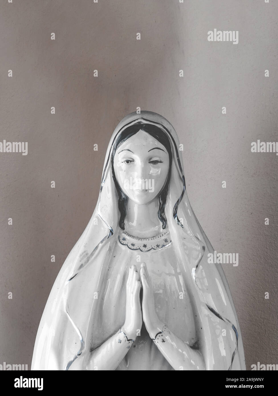 Virgin Mary porcelain statue in a vintage background Stock Photo - Alamy