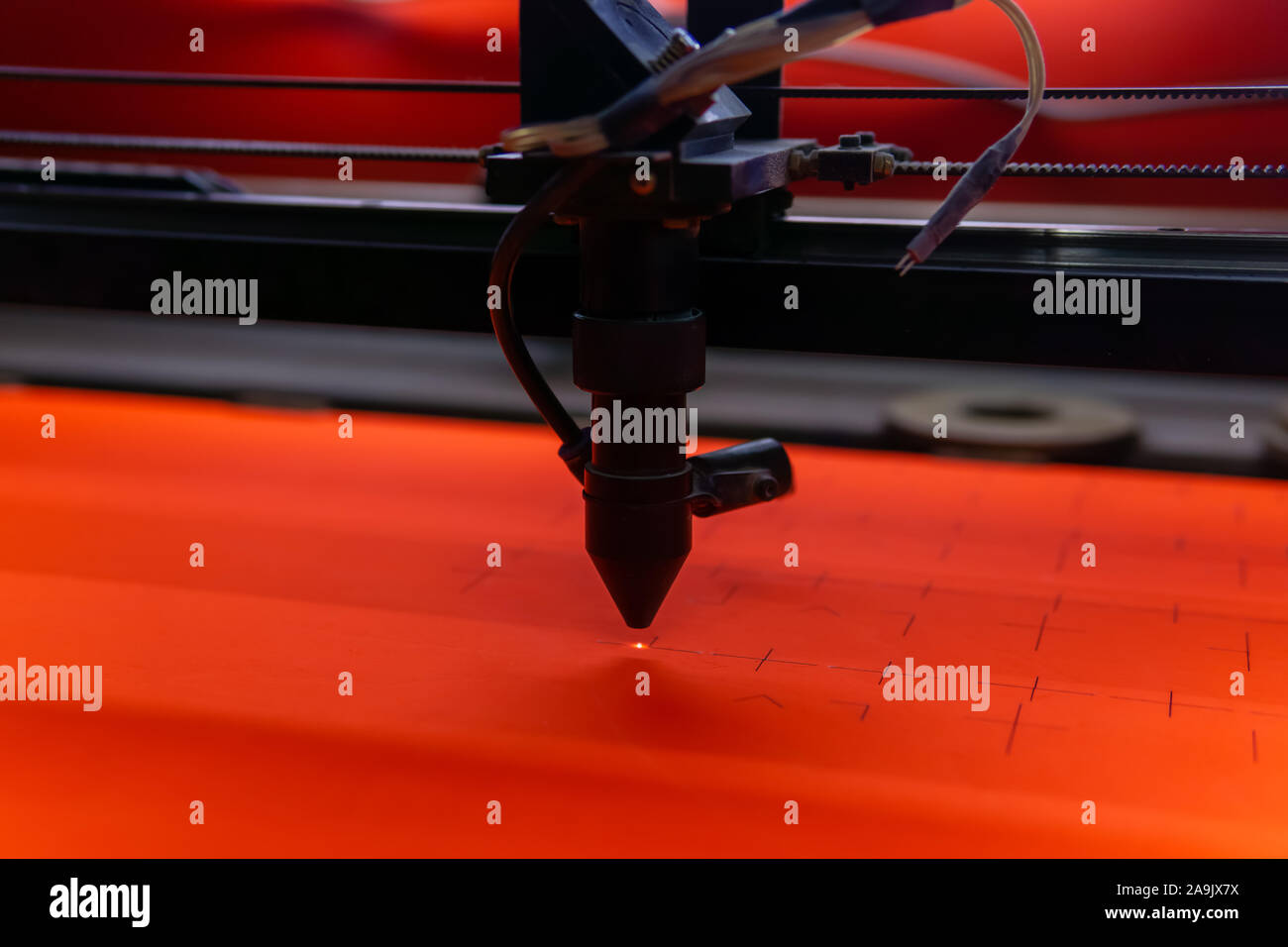 cutting slots in a plywood sheet using a laser machine Stock Photo Alamy