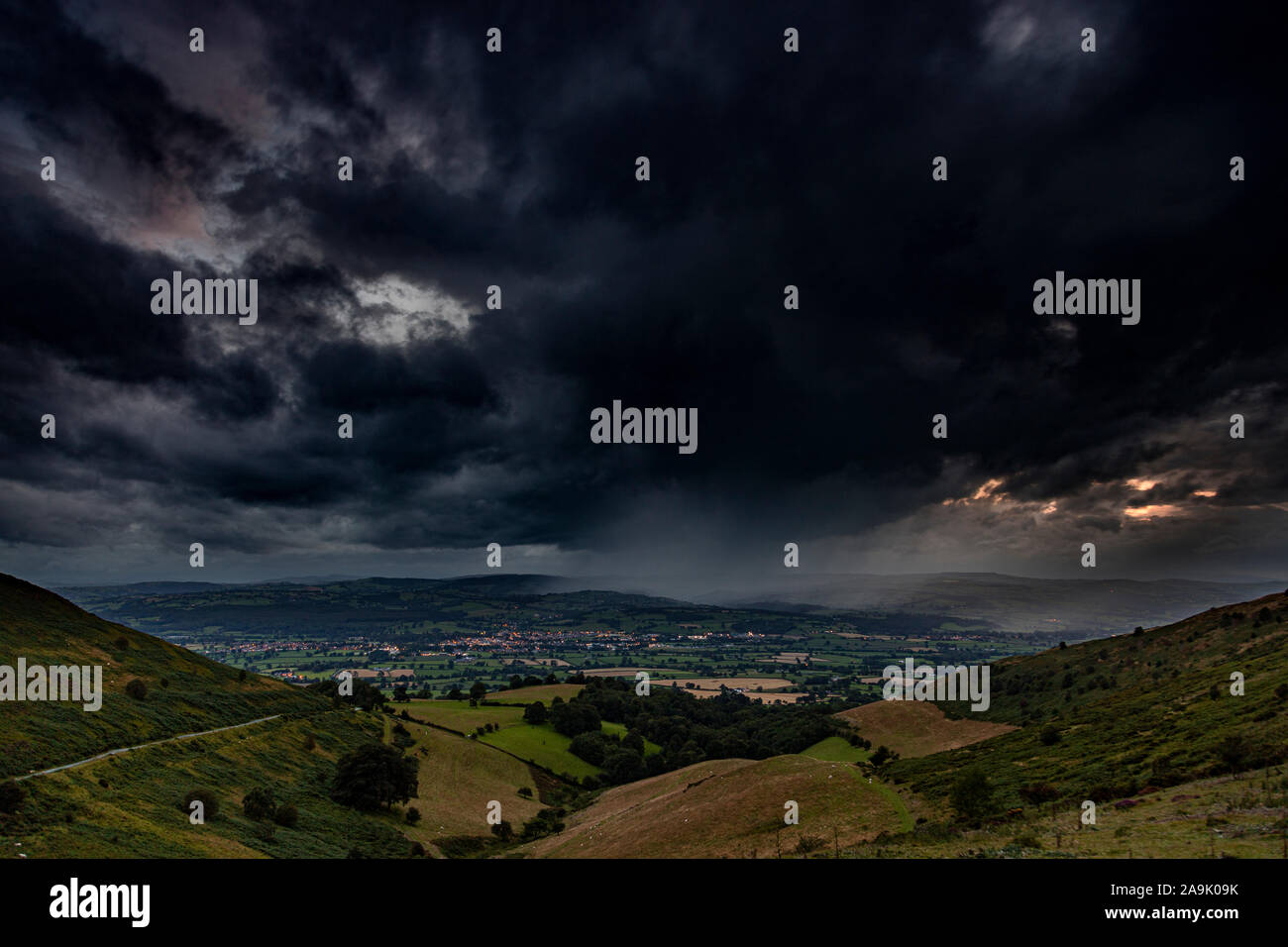 Rainstorm as dusk over the Vale of Clywd, North Wales Stock Photo