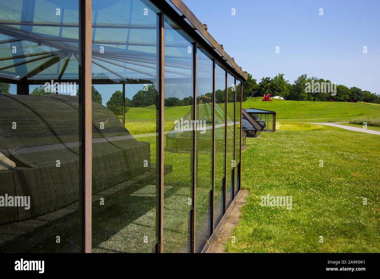 Sarcophagi in Glass Houses, by Magdalena Abakanowicz. On the lawn at Storm King Art Center, Hudsun Valley, Windsor, New York. Stock Photo