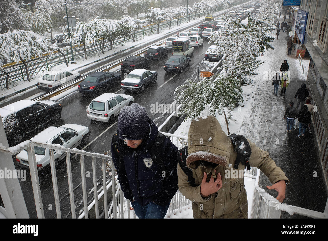 Tehran, IRAN. 16th Nov, 2019. Iranians walk amid the snow in the capital Tehran. Heavy snowfall blanketed the streets of north Tehran on Saturday, causing traffic chaos and forcing the closure of schools, authorities in the Iranian capital said. Credit: Rouzbeh Fouladi/ZUMA Wire/Alamy Live News Credit: ZUMA Press, Inc./Alamy Live News Stock Photo