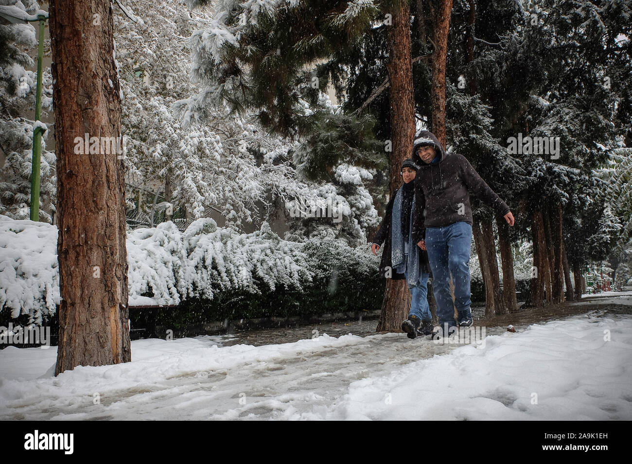Tehran, Iran. 16th Nov, 2019.  Iranians walk amid the snow in the capital Tehran. Heavy snowfall blanketed the streets of north Tehran on Saturday, causing traffic chaos and forcing the closure of schools, authorities in the Iranian capital said. (Credit Image: © Rouzbeh Fouladi/ZUMA Wire) Credit: ZUMA Press, Inc./Alamy Live News Stock Photo