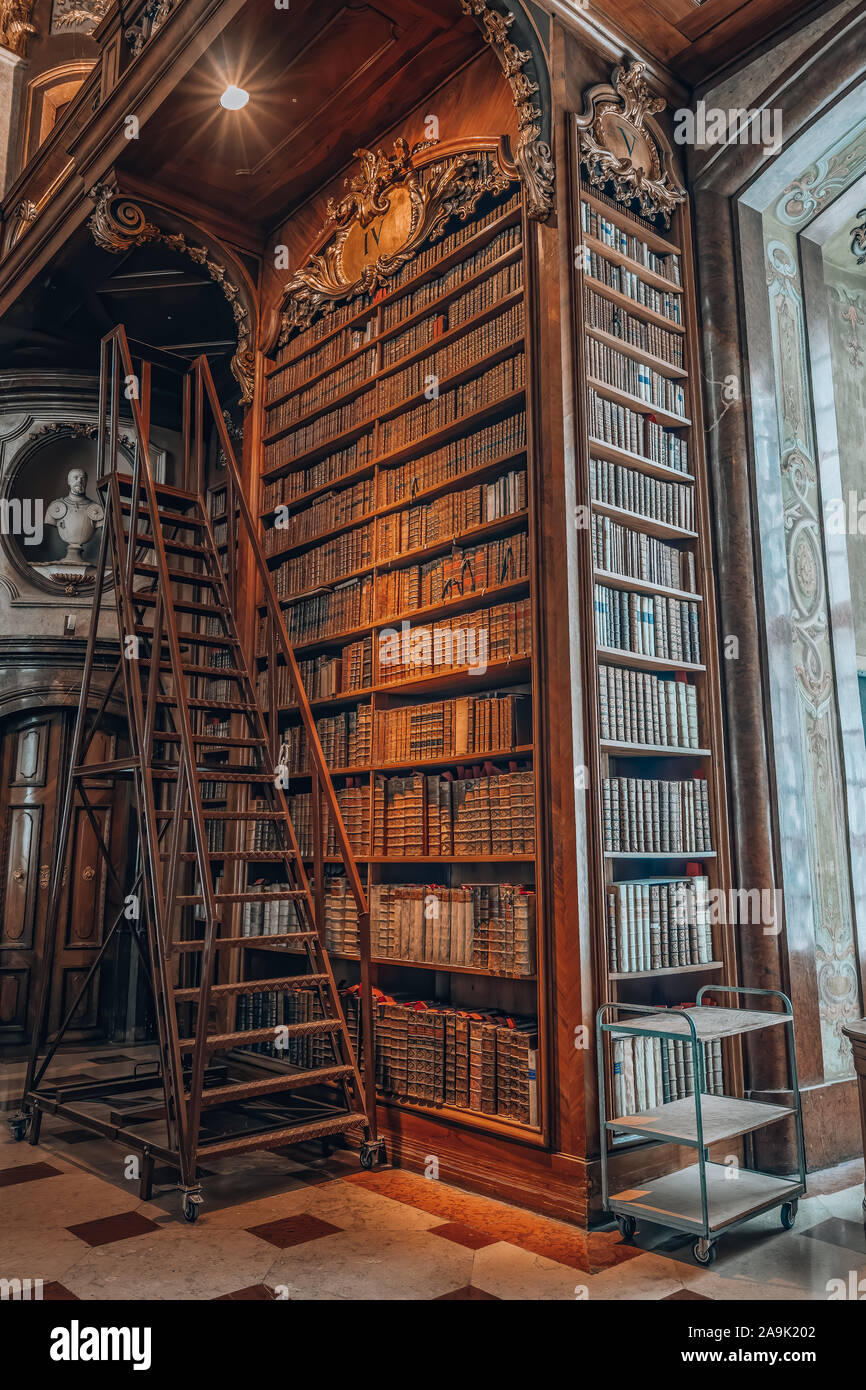 Vienna, Austria - April 28, 2019: Ladders besides antique bookshelf filled  with old books inside imperial library Stock Photo - Alamy