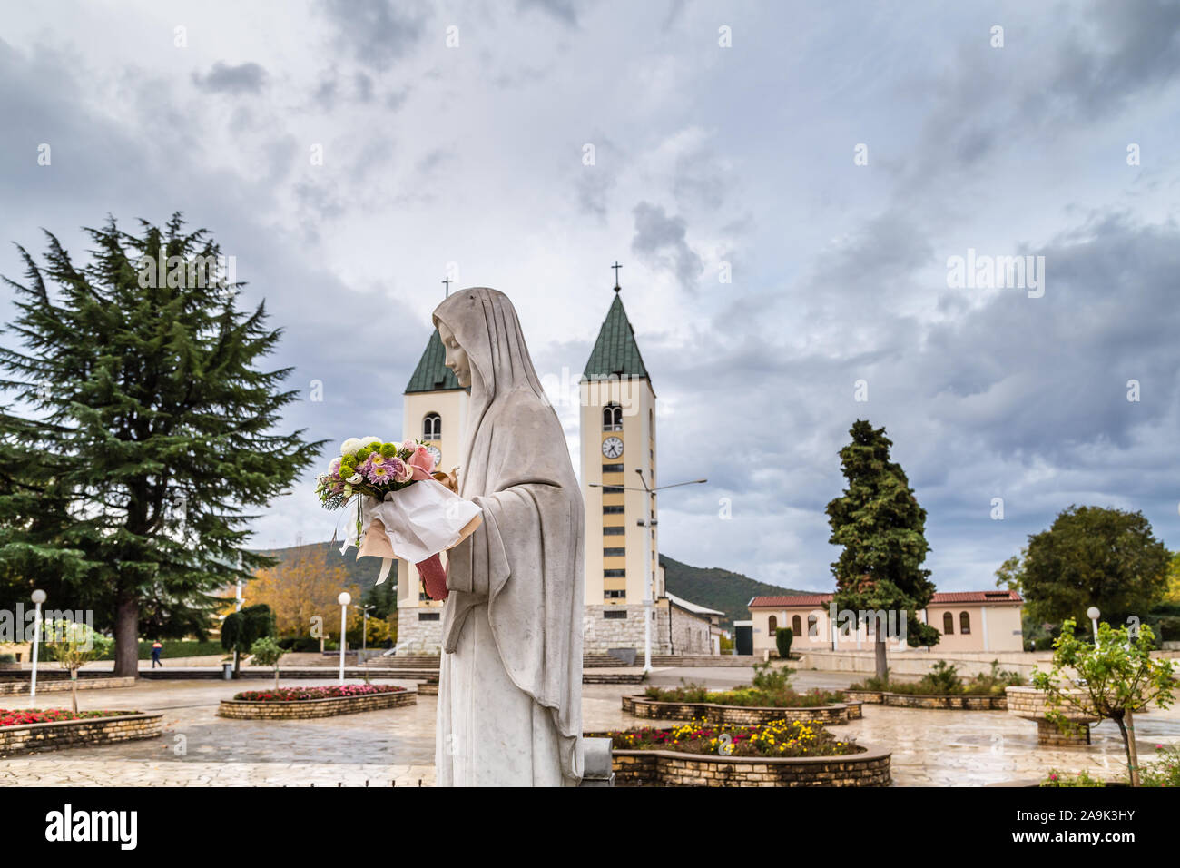 Virgin mary holding flowers in hi-res stock photography and images - Alamy