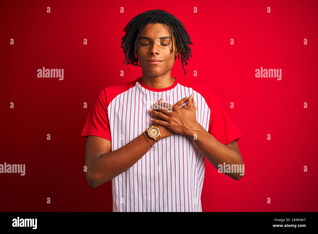 Dreadlocks Chest Afro man with dreadlocks wearing striped t-shirt standing over isolated ...