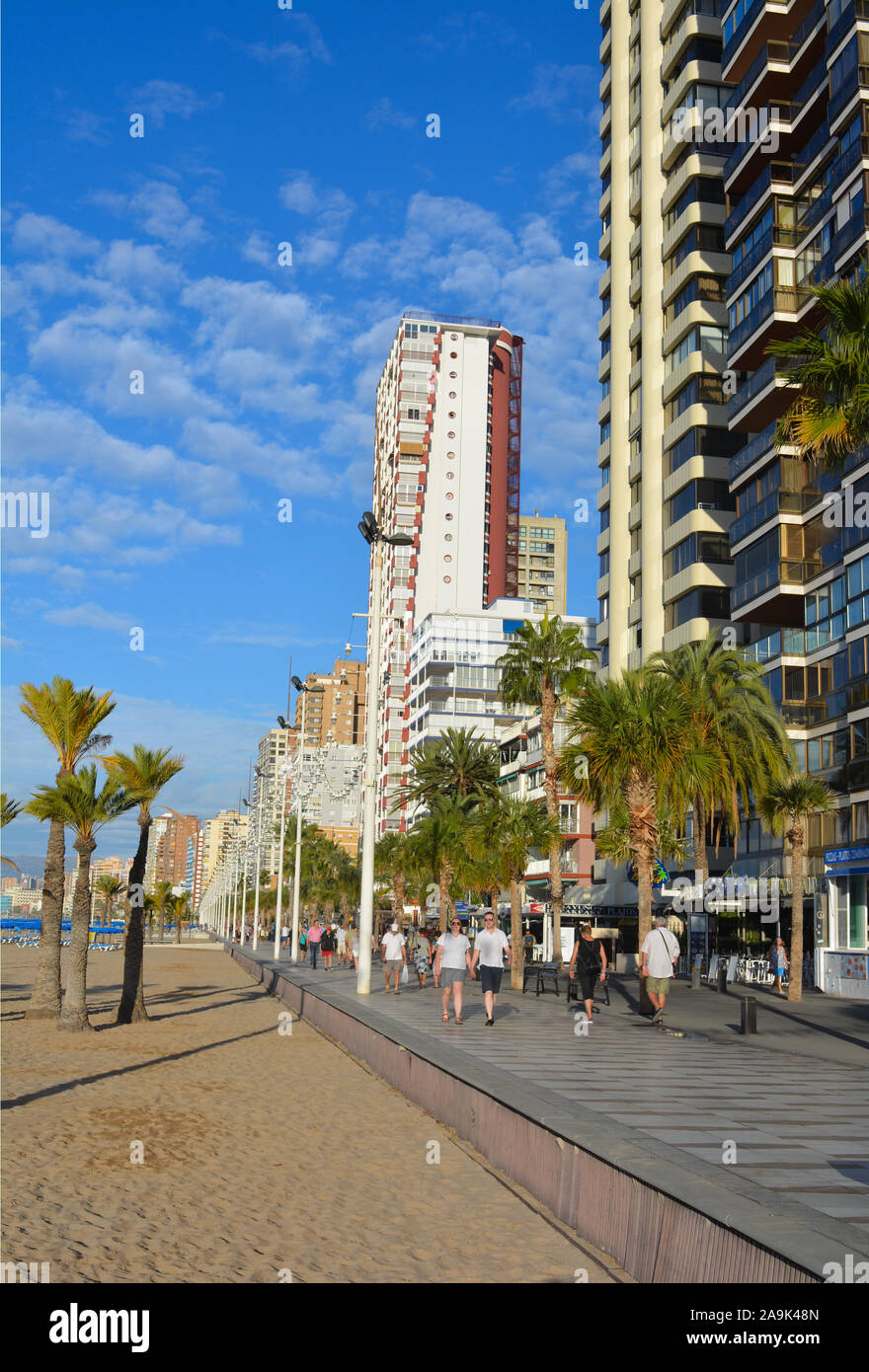 People Walking On The Promenade Of Playa Levante Beach Early
