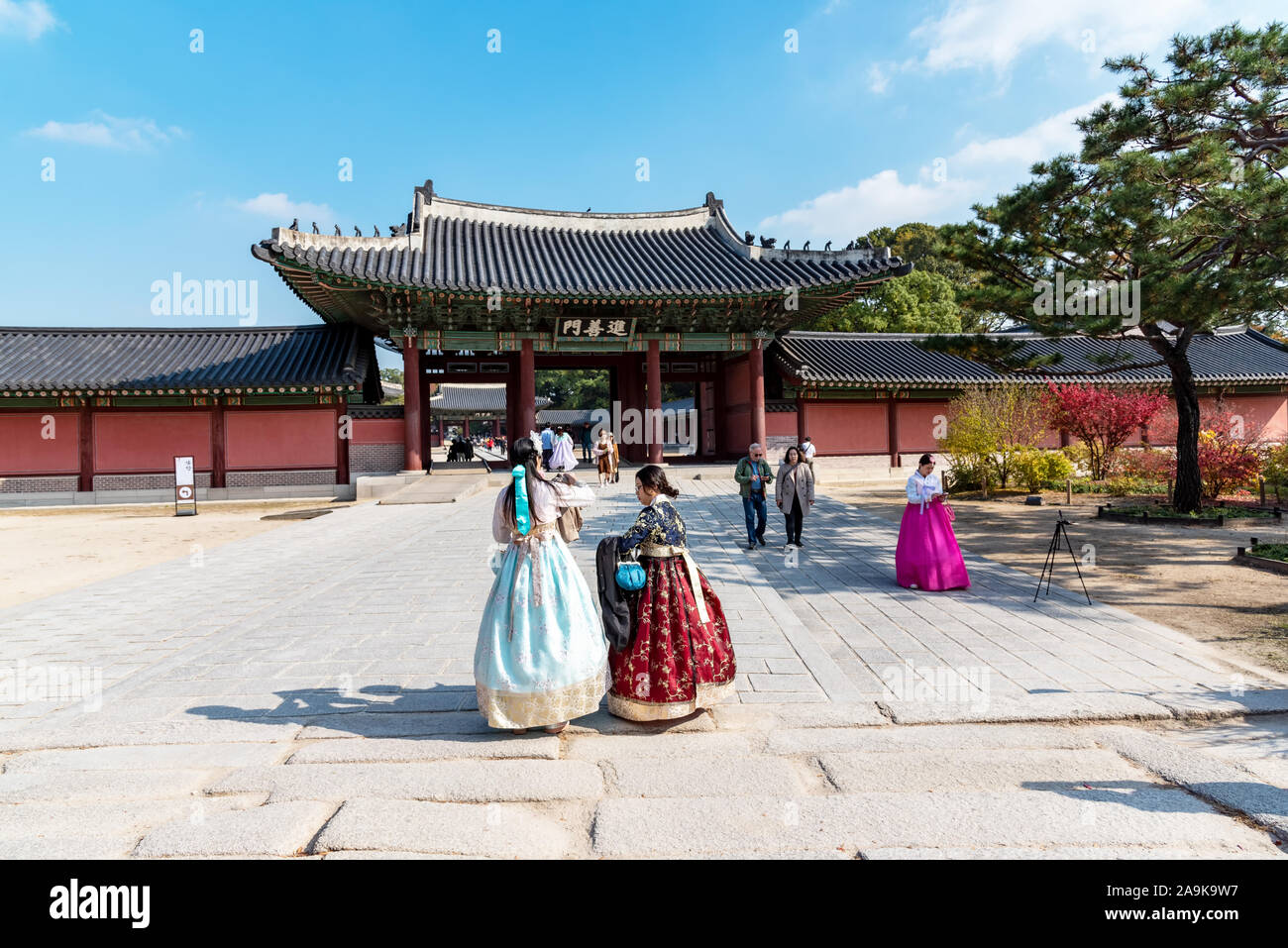 Seoul, South Korea - November 05, 2019: Tourists at Changdeokgung palace during autumn season. Located in Jongno-Gu, its listed as  UNESCO World Herit Stock Photo