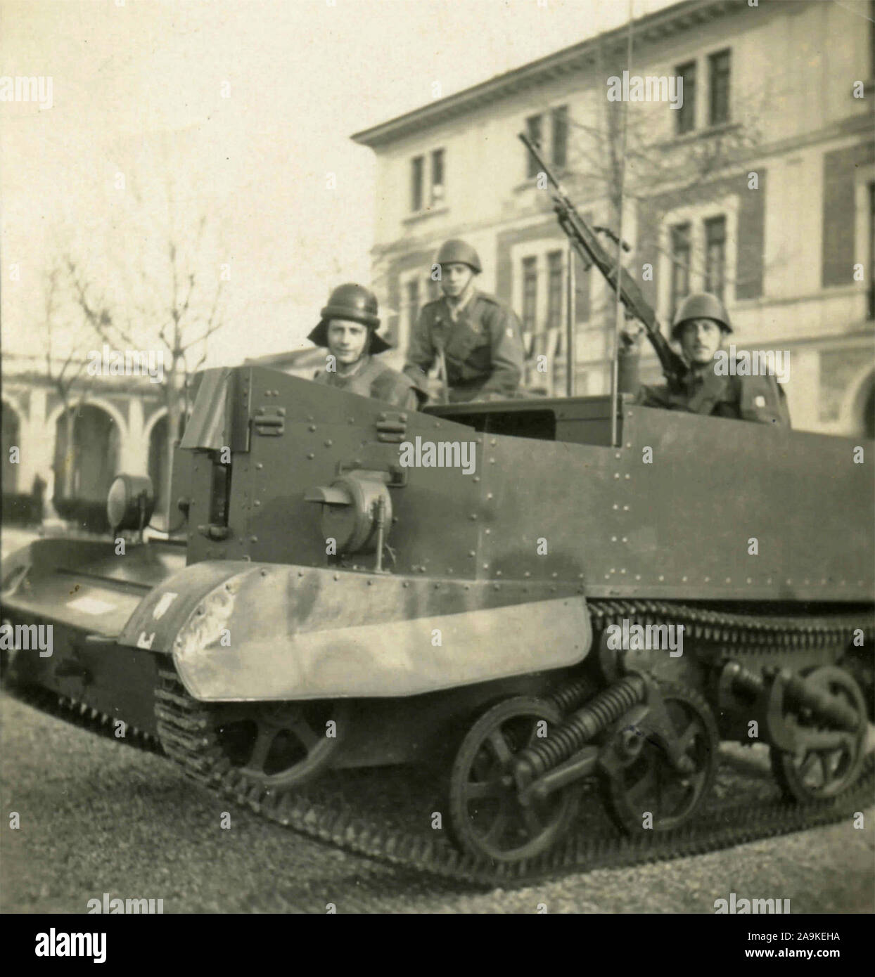 Three soldiers on a tank in Udine, Italy Stock Photo