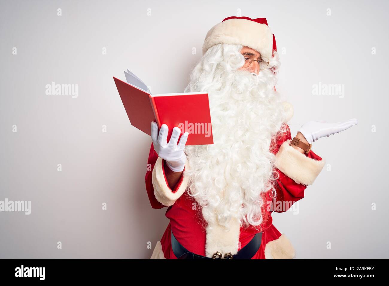 Santa claus hands holding book hi-res stock photography and images - Alamy