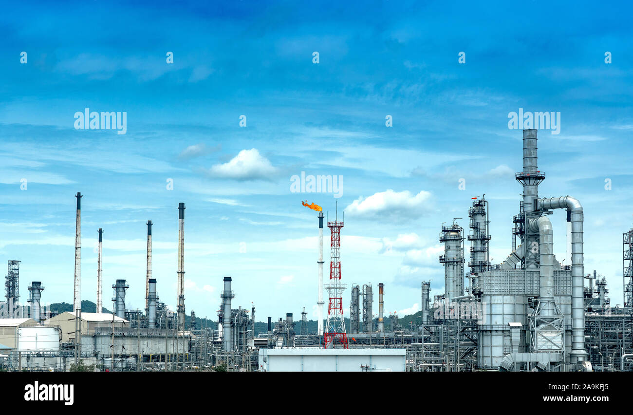 Oil and gas refinery plant form industry petroleum zone,Refinery equipment pipeline steel and oil storage tank at sunrise. -image Stock Photo