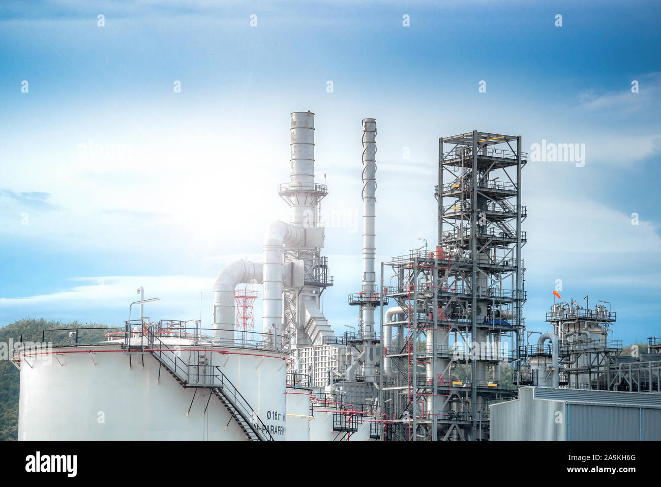 Close up Industrial view at oil refinery plant form industry zone with sunrise and cloudy sky Stock Photo