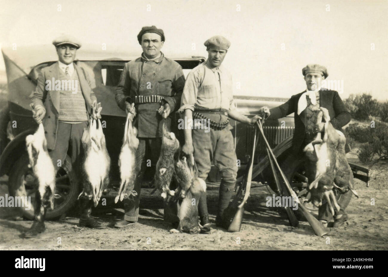 Group of hunters shows the game killed , Italy Stock Photo