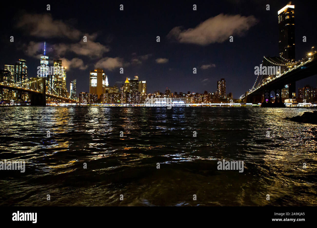 Nighttime cityscape with bridges and river Stock Photo