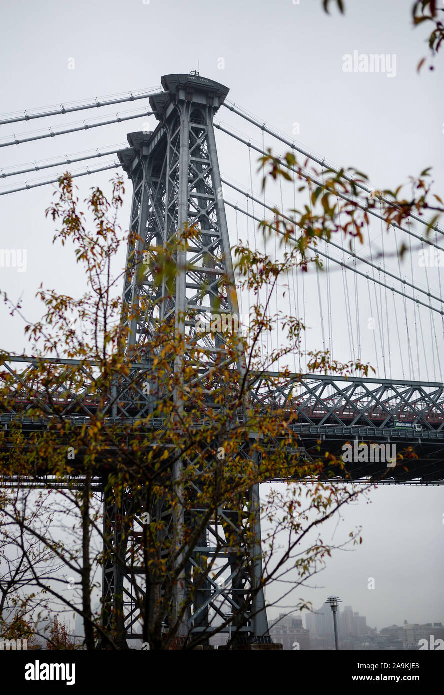 Suspension bridge tower with autumn leaves Stock Photo