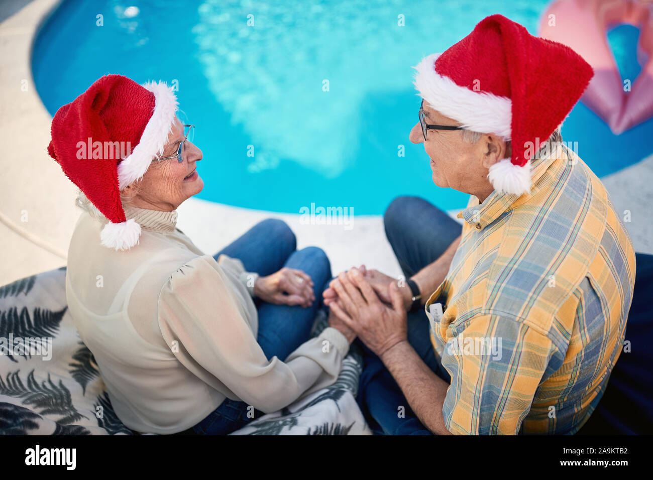 loving smiling senior man and woman together celebrating Christmas Stock Photo