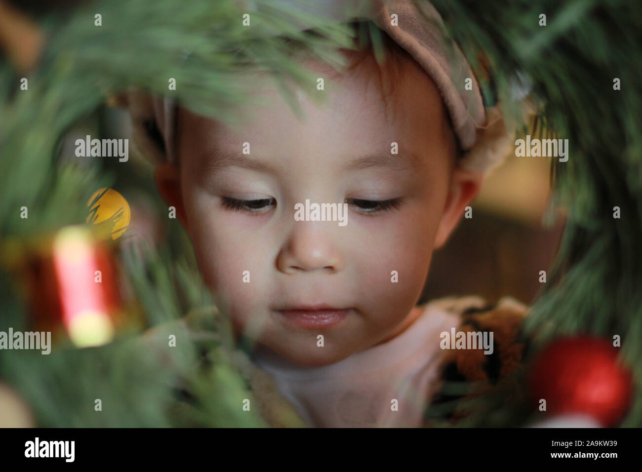 Child face christmas mood. Enthusiastic child. Good New Year spirit. Boy's face close up. Positive emotions. christmas mood. Stock Photo