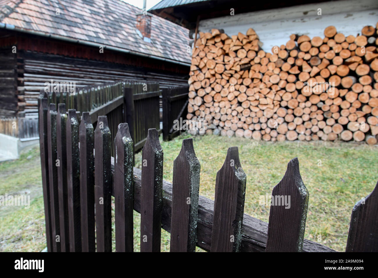 VLKOLINEC, SLOVAK REPUBLIC - DECEMBER 29, 2015: Beautiful architecture with wooden fence from UNESCo village. Stock Photo
