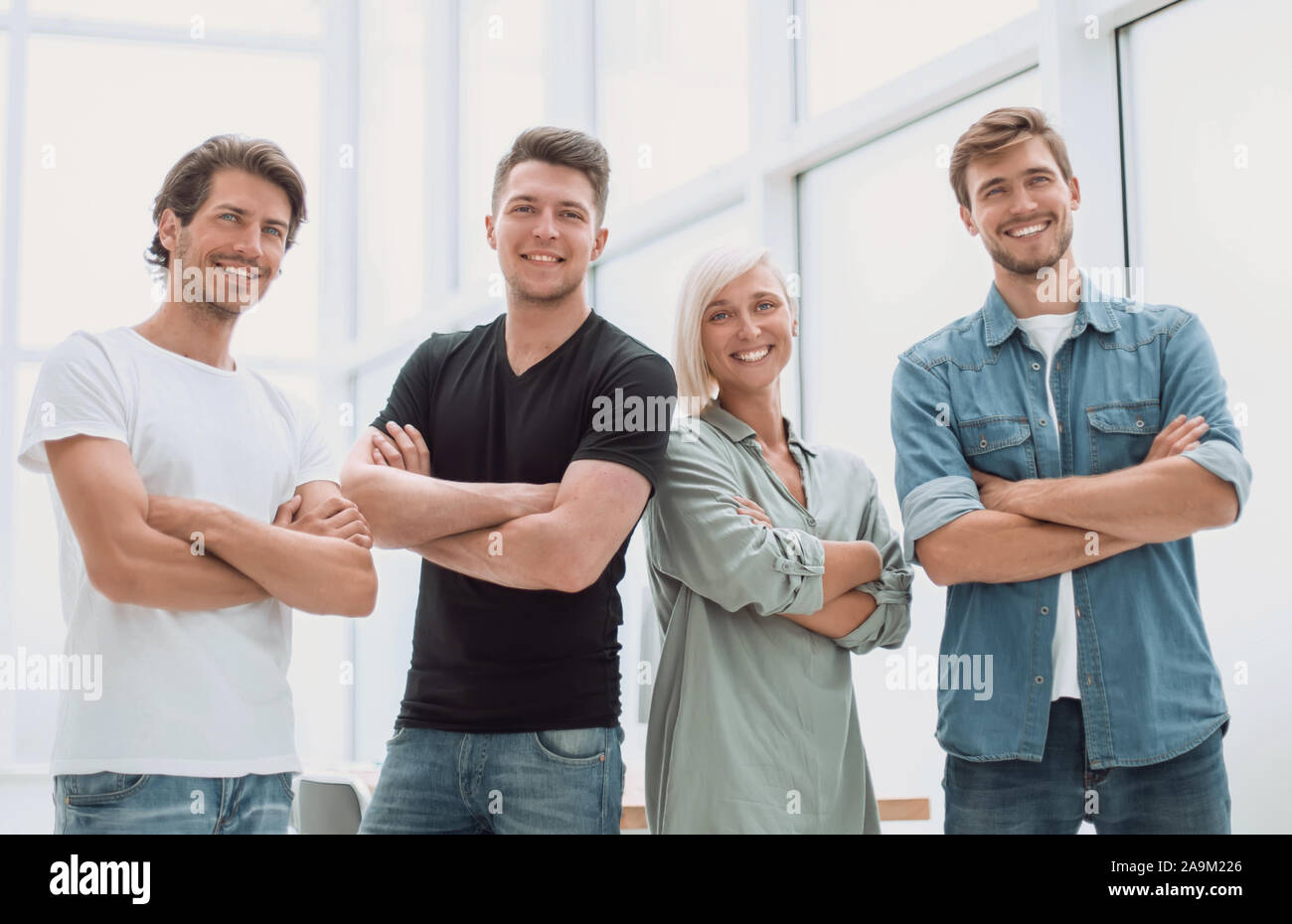 group of successful young people standing in the office Stock Photo - Alamy