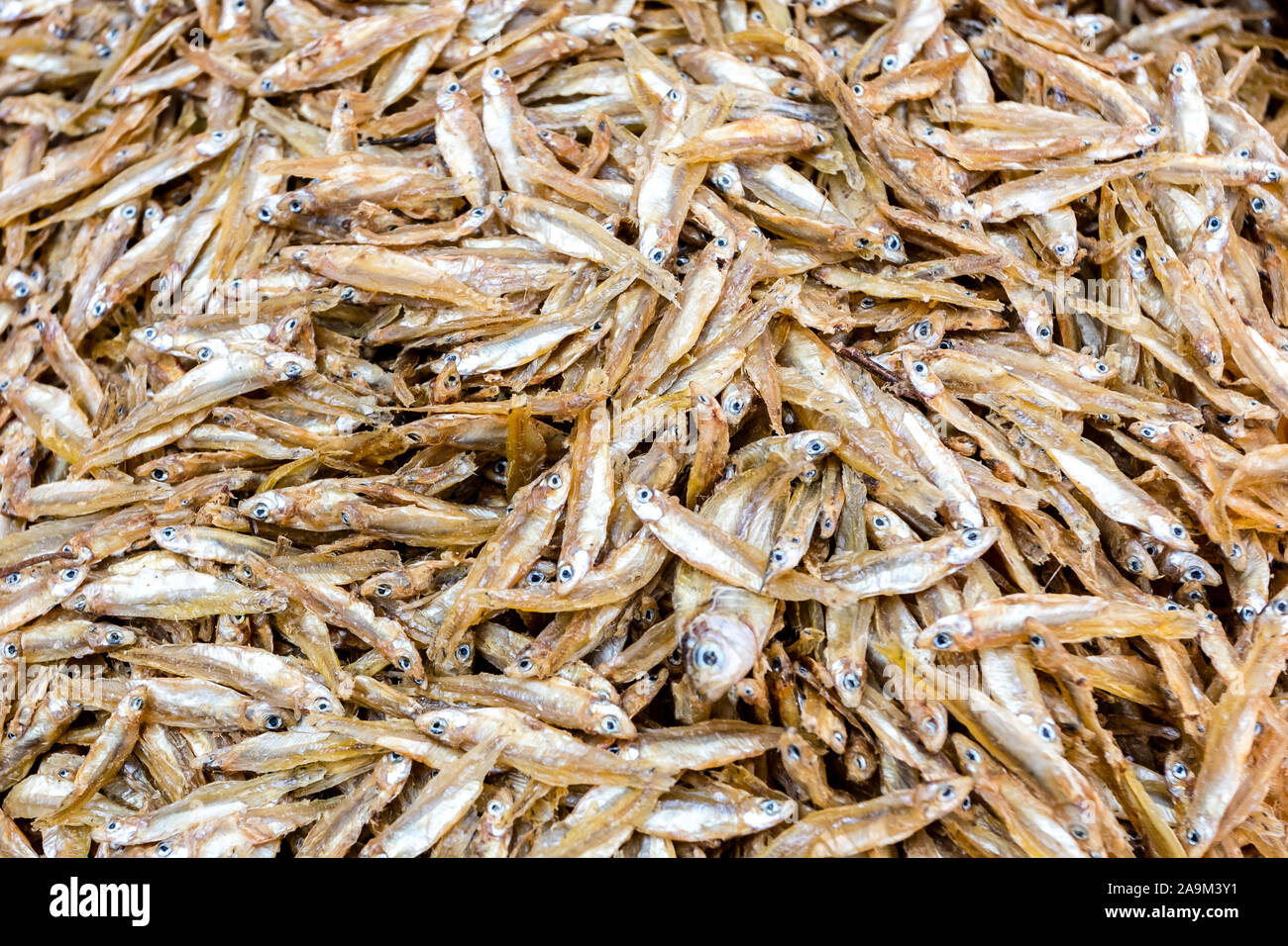 Texture food background of stockfish. Small dried fish at a street