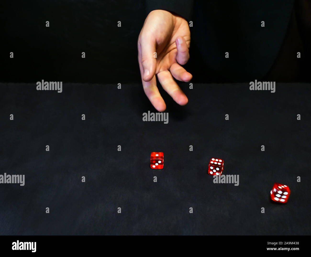 Hand throws dice hires stock photography and images Alamy