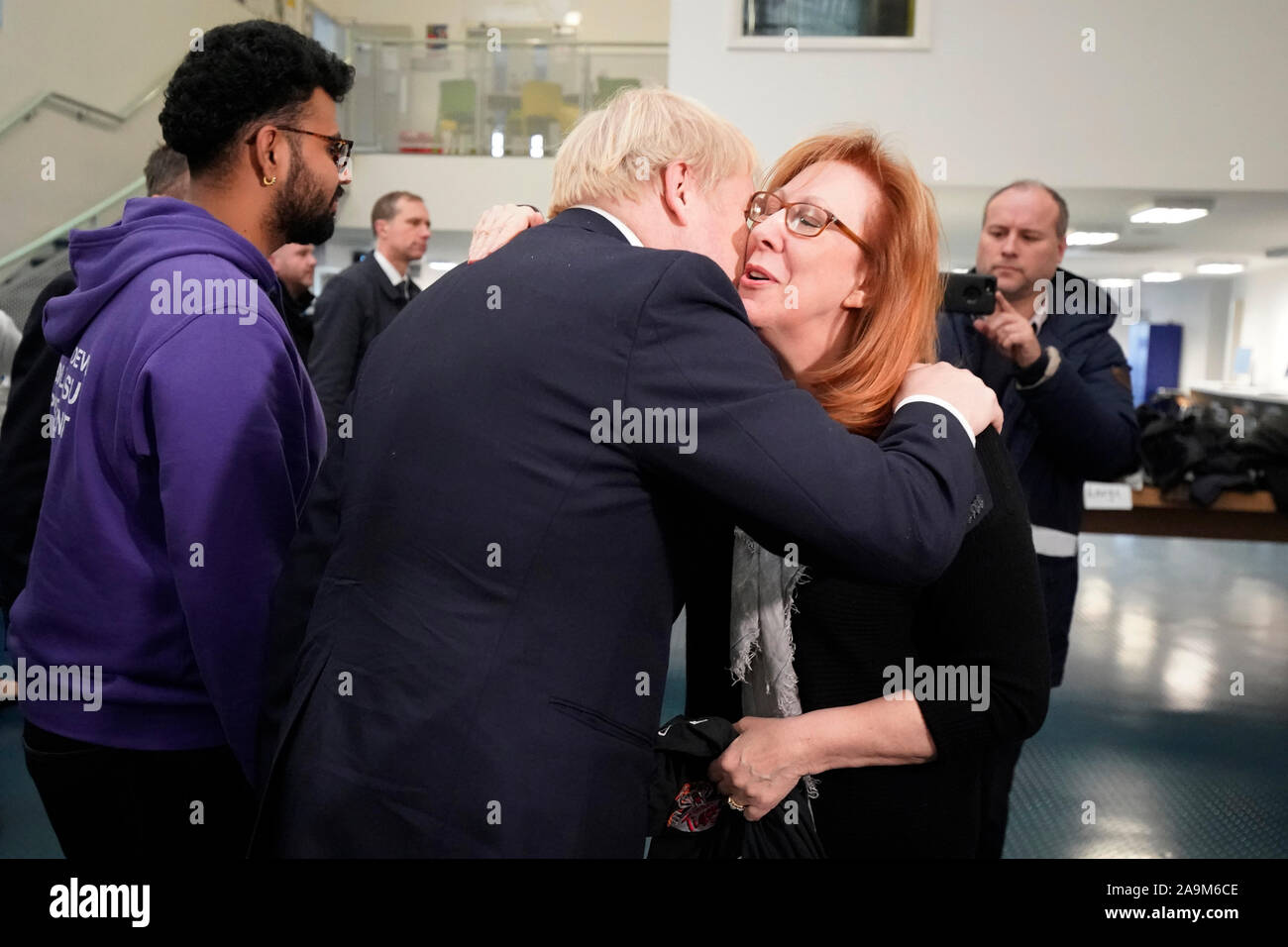 Prime Minister Boris Johnson greets staff and students during a visit