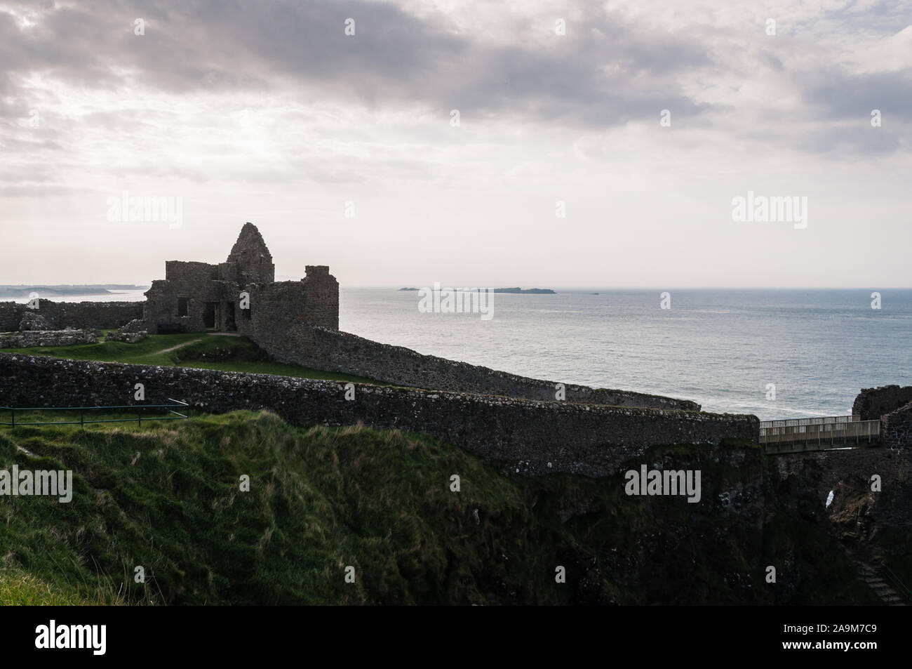 View of the remains of Dunluce castle on the Irish coast of Northern Ireland, County Antrim. Stock Photo