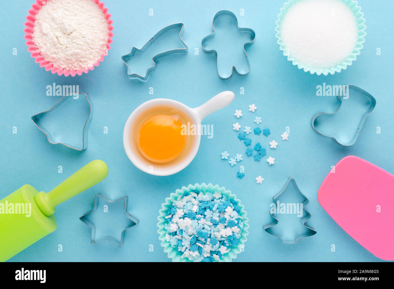 ingredients and cookie cutter on blue background, flat lay Stock Photo