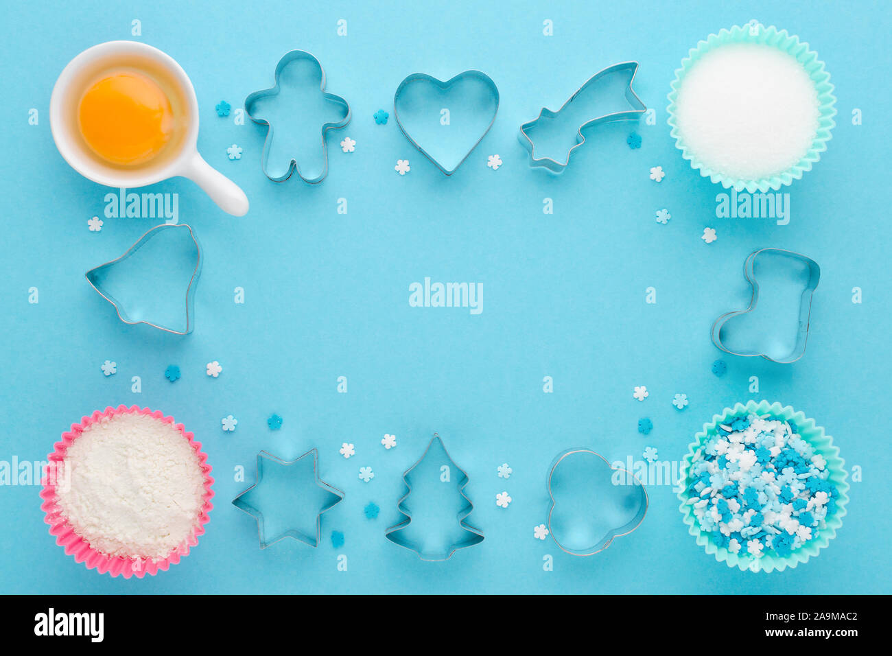 ingredients and cookie cutter on blue background, flat lay Stock Photo