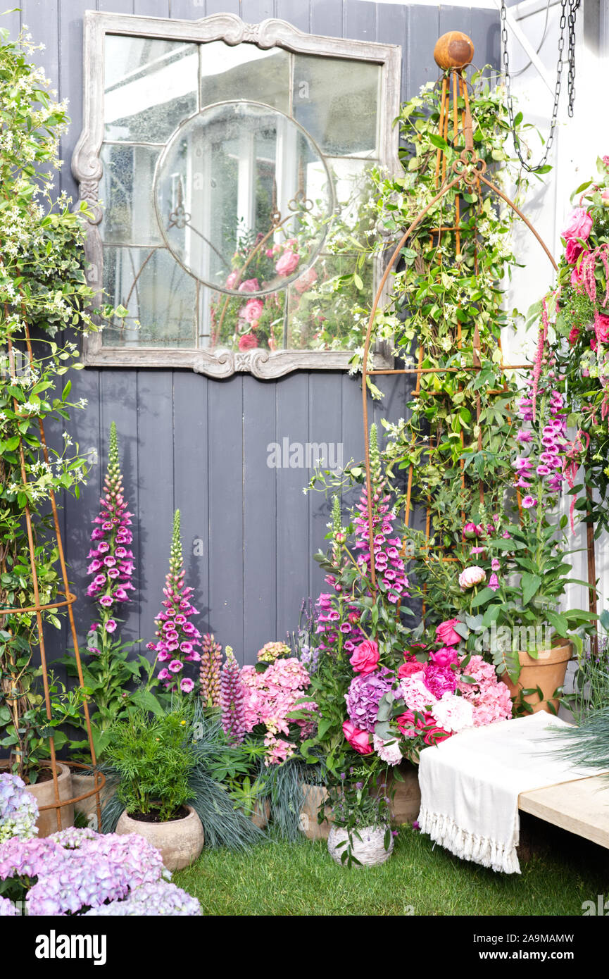 Garden fence with hollyhocks hi-res stock photography and images - Alamy