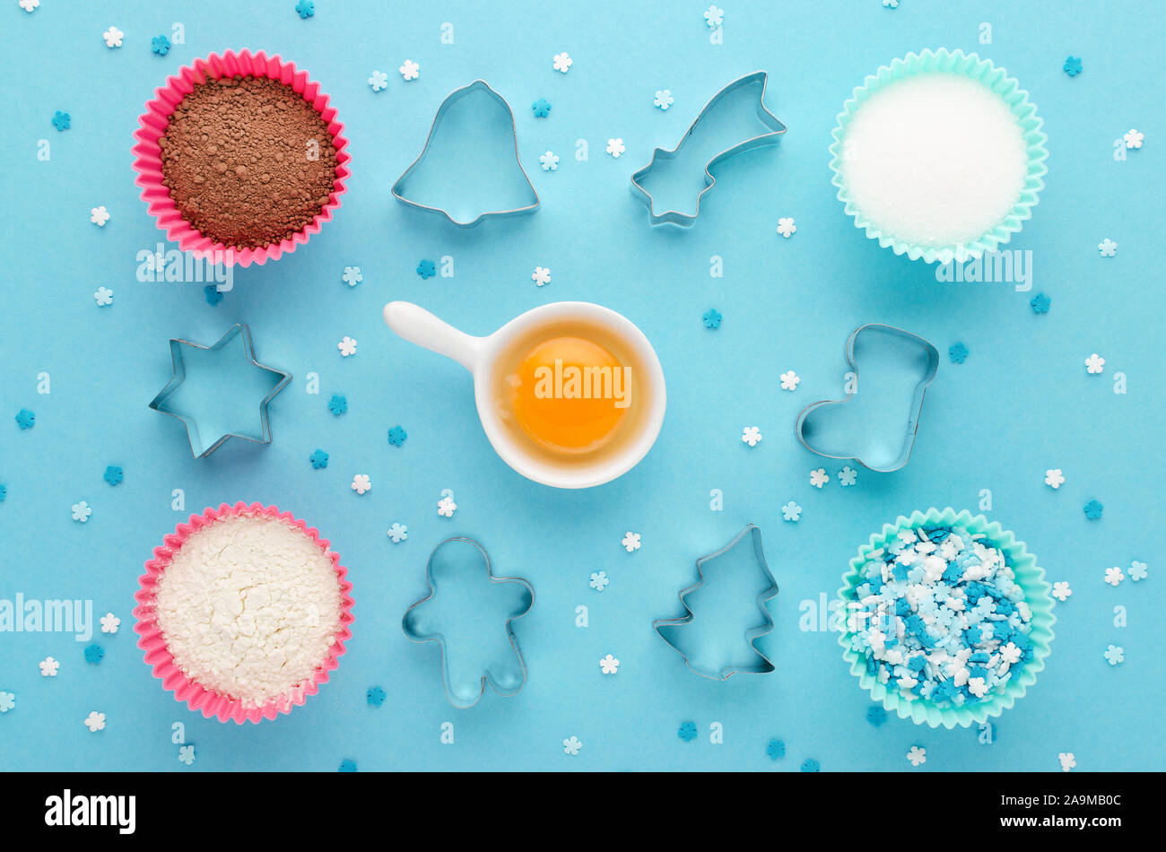 ingredients and cookie cutter on blue background, flat lay Stock Photo
