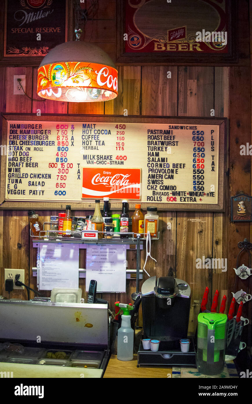 Menu board and food prep area of an old fashioned tavern restaurant Stock Photo