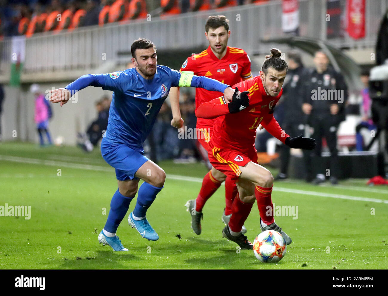 BUDAPEST, HUNGARY - AUGUST 9: Gara Garayev of Qarabag FK fouls Aissa  Laidouni of Ferencvarosi TC during the UEFA Champions League Qualifying  Round match between Ferencvarosi TC and Qarabag FK at Ferencvaros