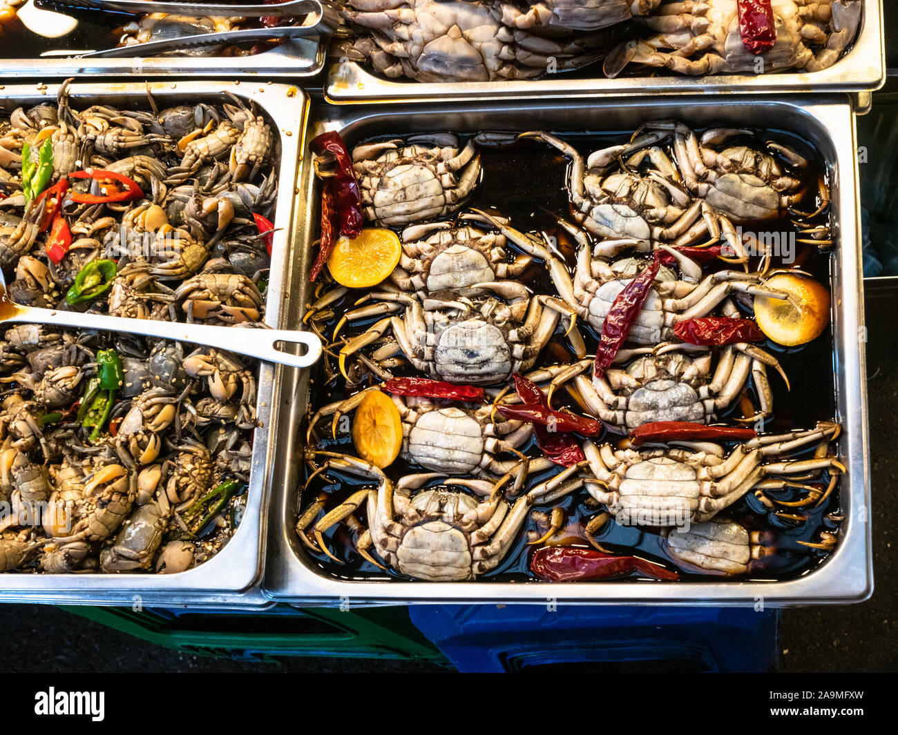 Korean cuisine top view of many pickled in soy sauce little crabs in