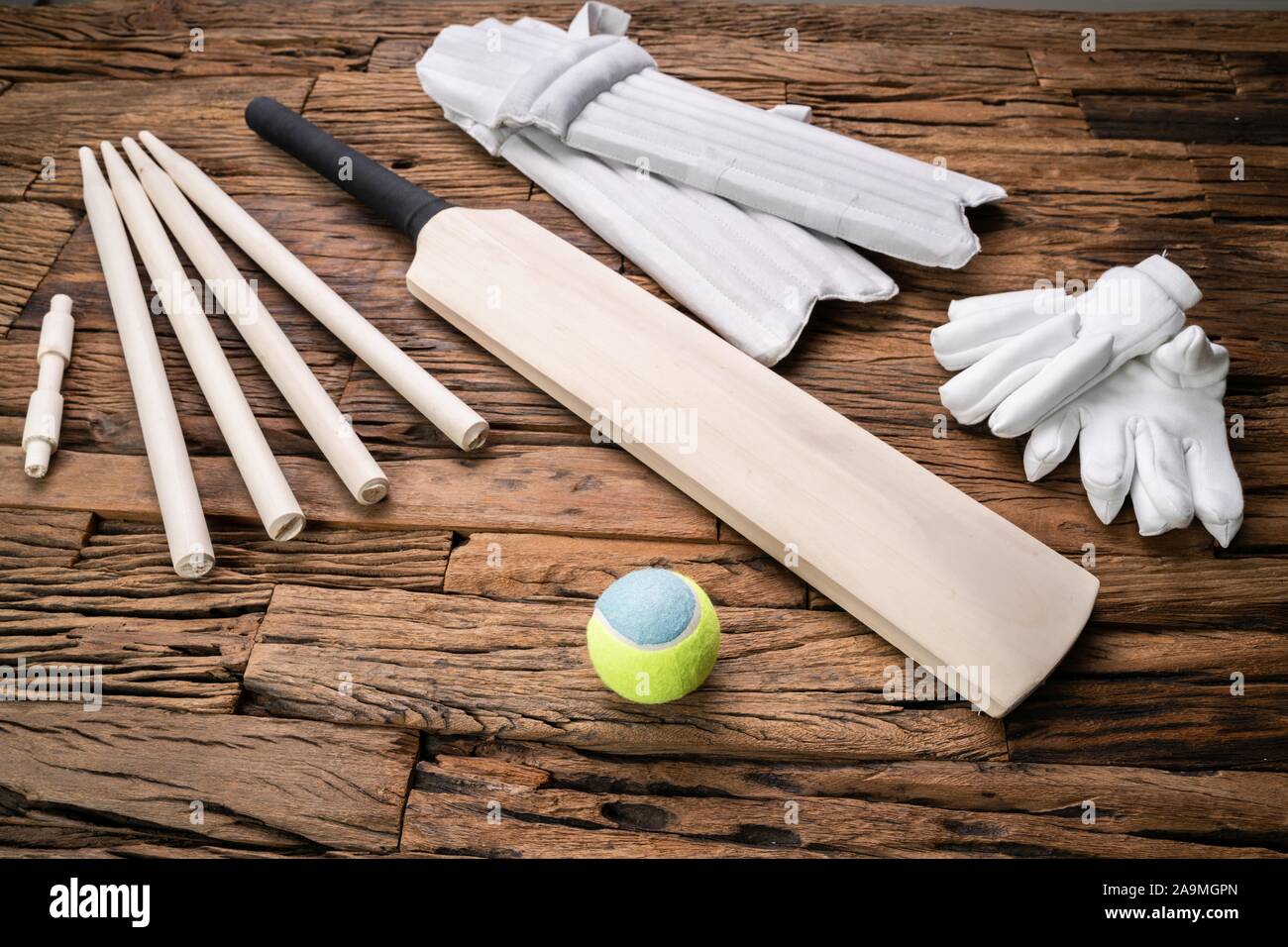 Elevated View Of Cricket Accessories And Tools On Brown Textured Backdrop Stock Photo Alamy