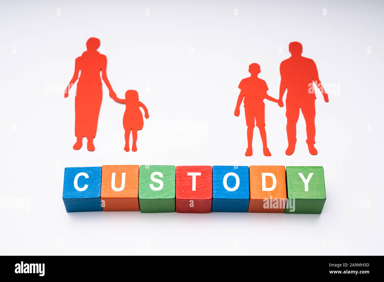 Elevated View Of Word Custody With Paper Figures Of Family On White Background Stock Photo